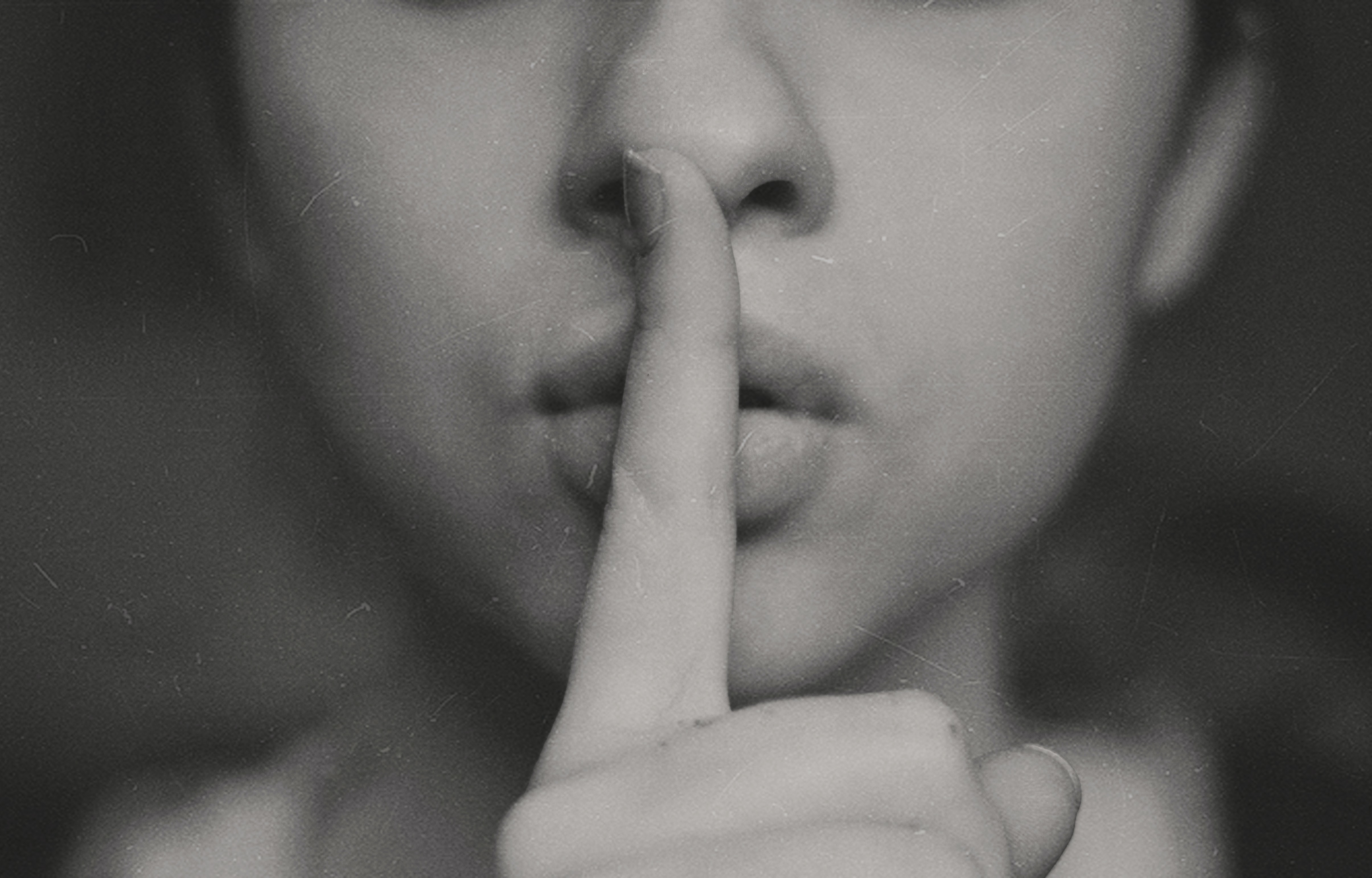 black-and-white-photo-of-woman-saying-shhh