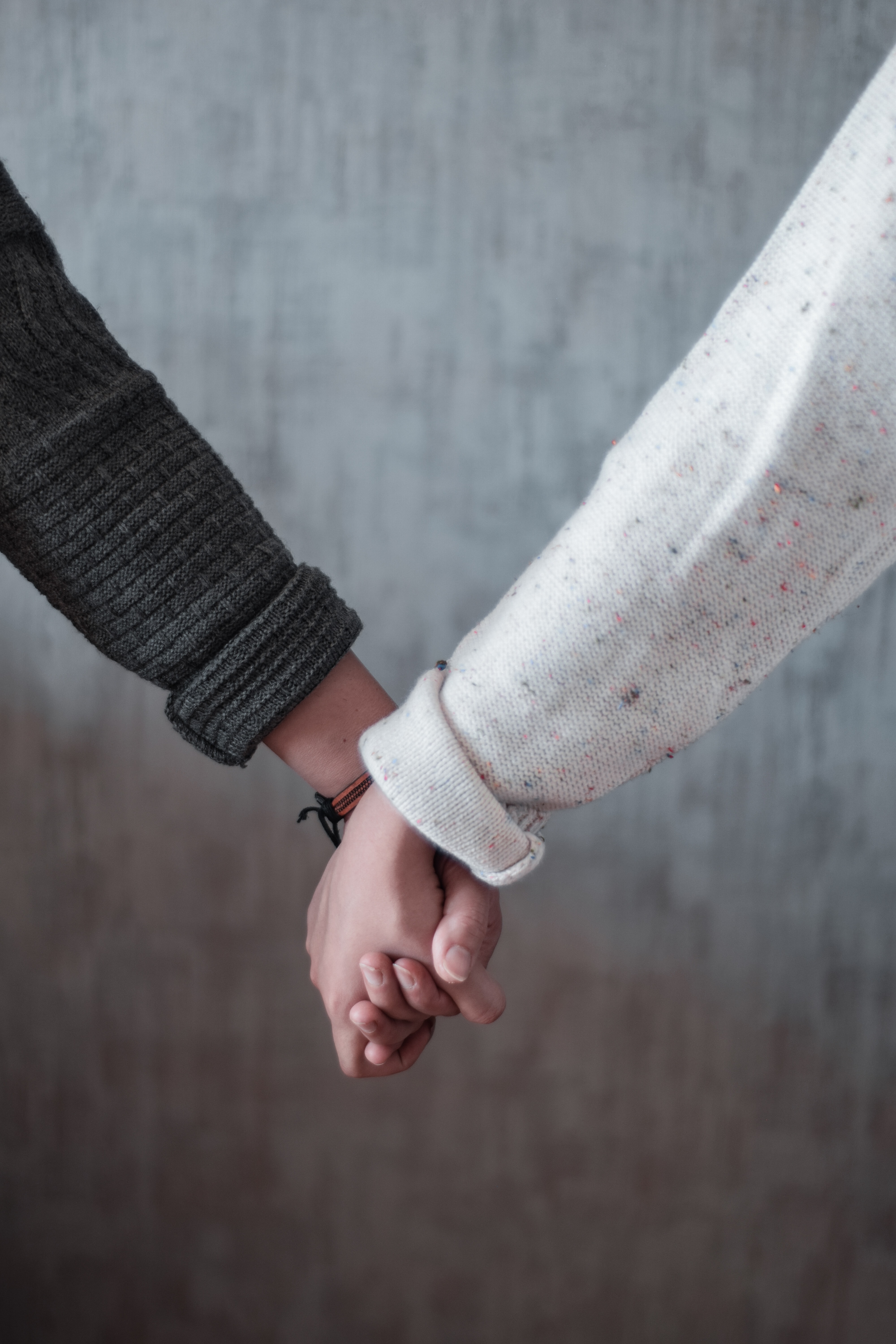 two-people-holding-hands