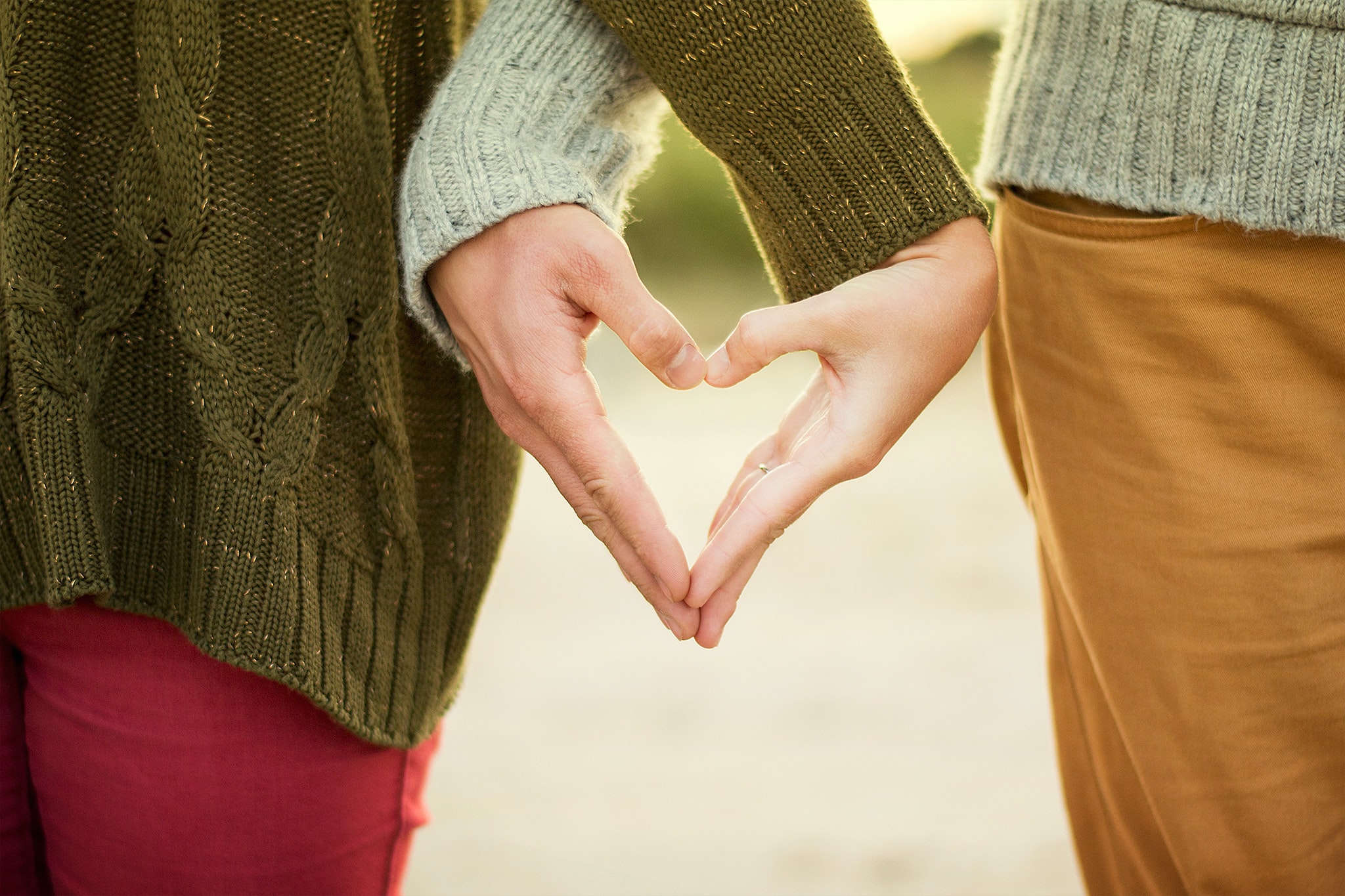 couple-making-heart-with-hands