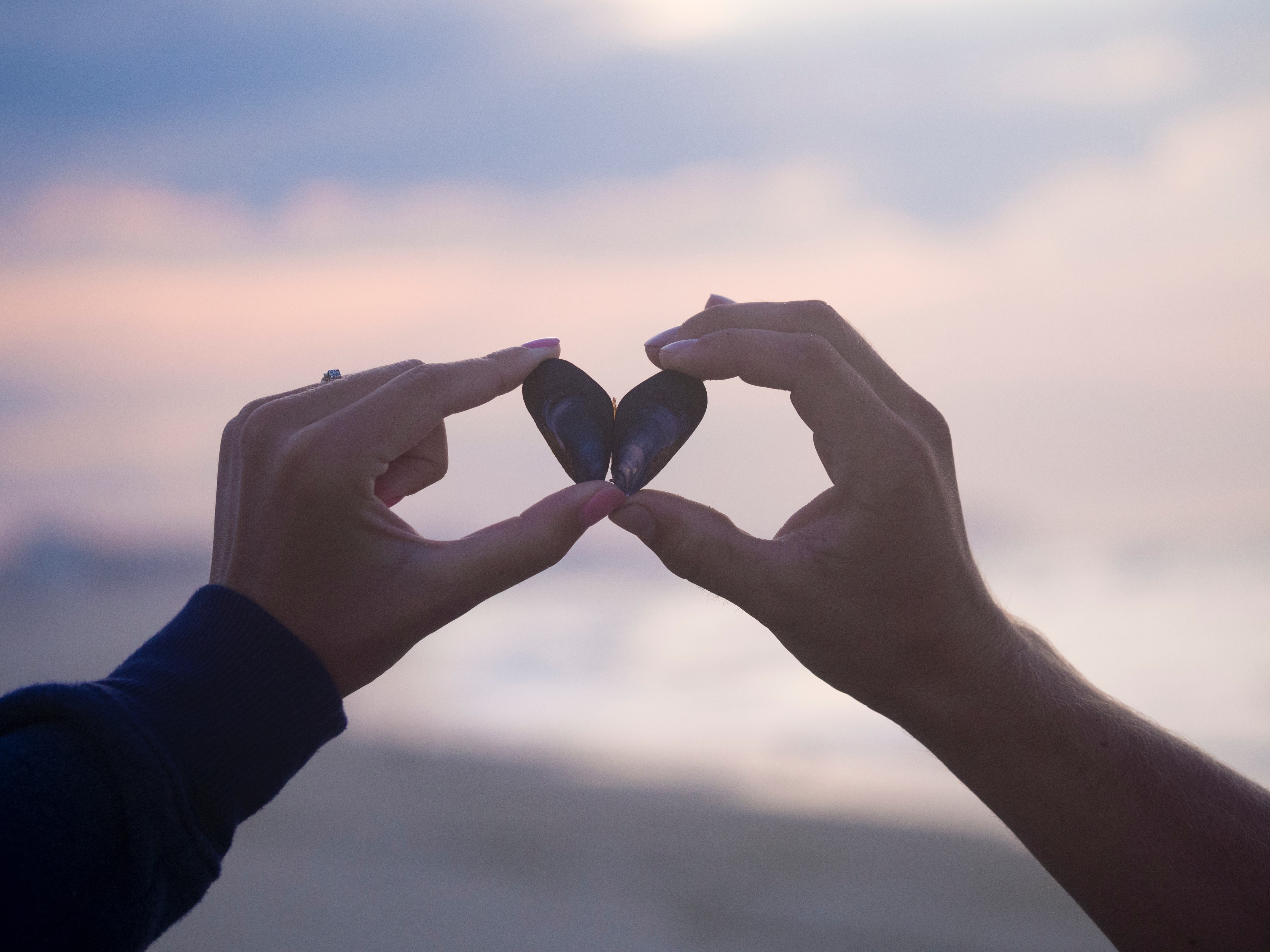 two-hands-holding-heart-together