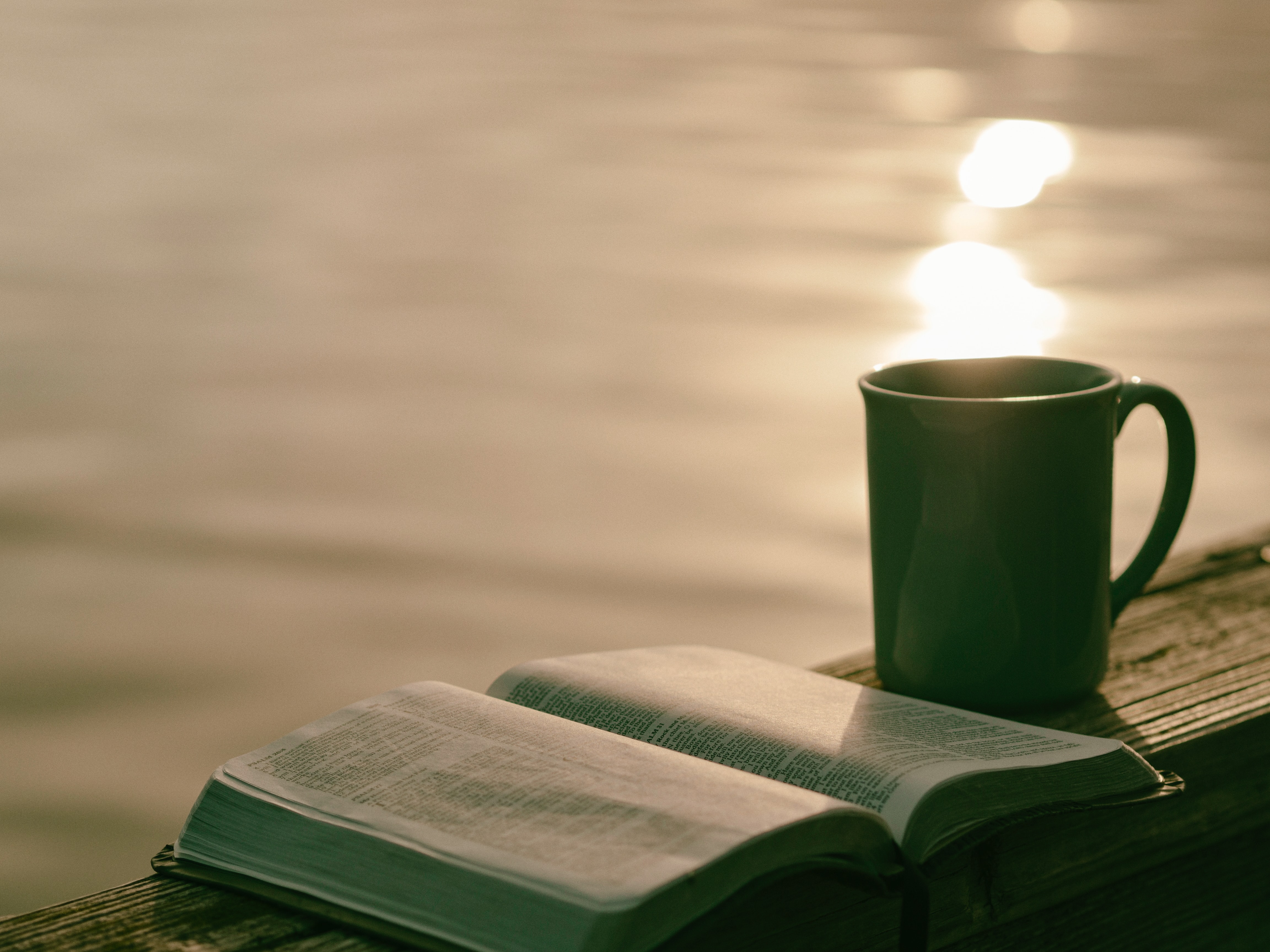 cup-of-coffee-and-book-on-lake