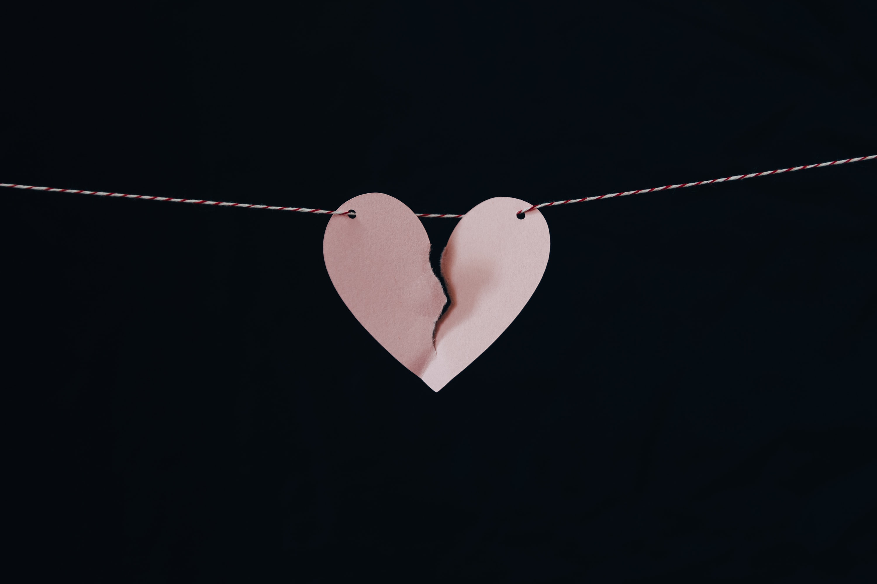 broken-paper-heart-on-string
